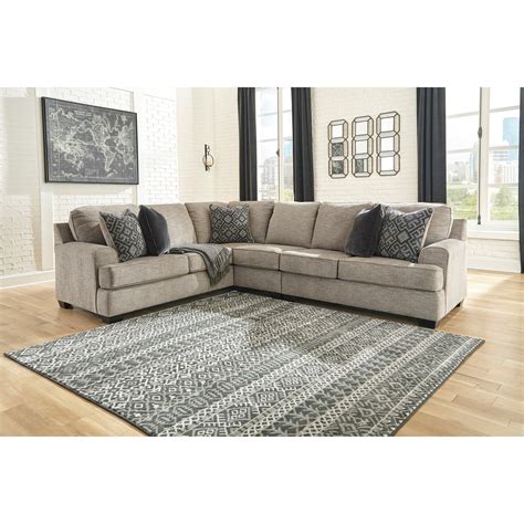 Attached back and loose seat cushions. . 3 piece upholstered sectional
